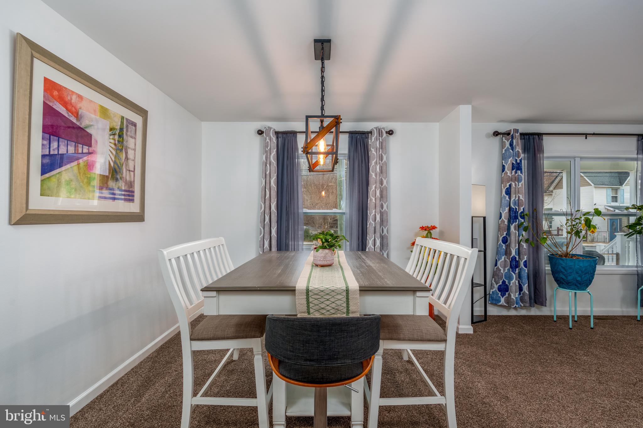 158 Main Street Hartly, DE 19953 - Photo 9 of 31 a view of a dining room with furniture window and wooden floor