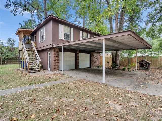 a kitchen with granite countertop a sink stove and cabinets