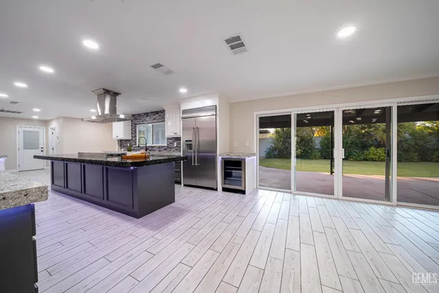 a outdoor space with a large window and couch