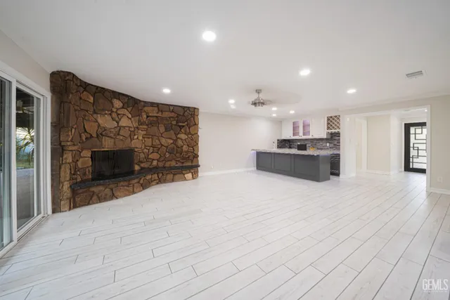 a view of kitchen cabinets and wooden floor