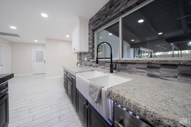 a view of room with cabinet and windows