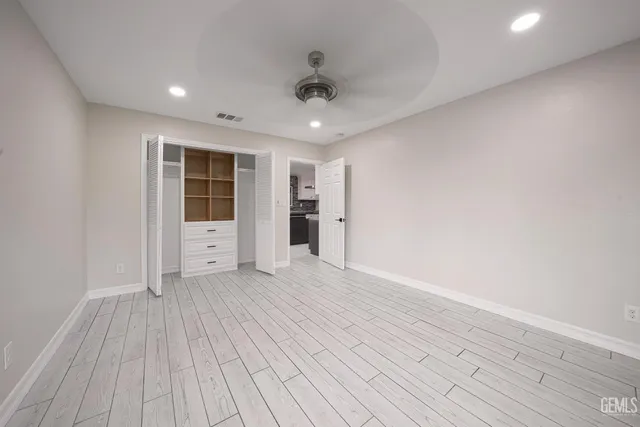 a bathroom with a toilet a sink a shower and a mirror