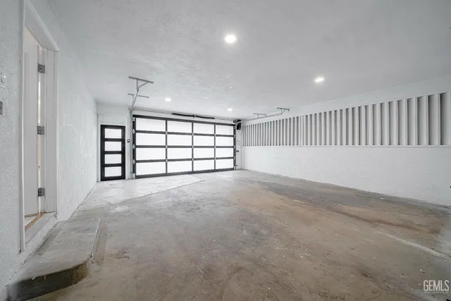 a view of a livingroom with wooden floor and a fireplace