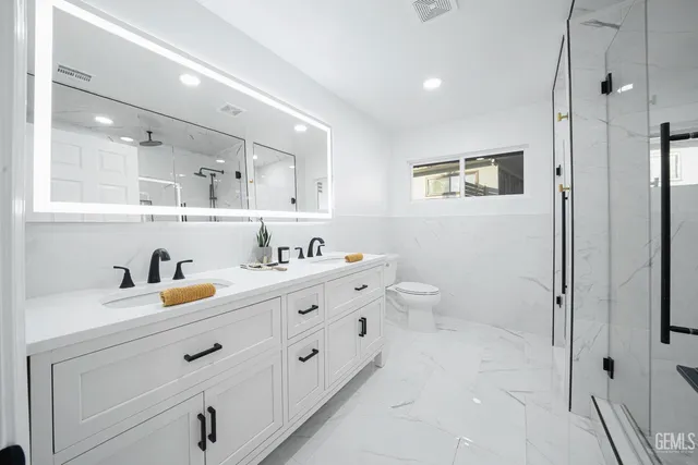 a bathroom with a shower and a glass door