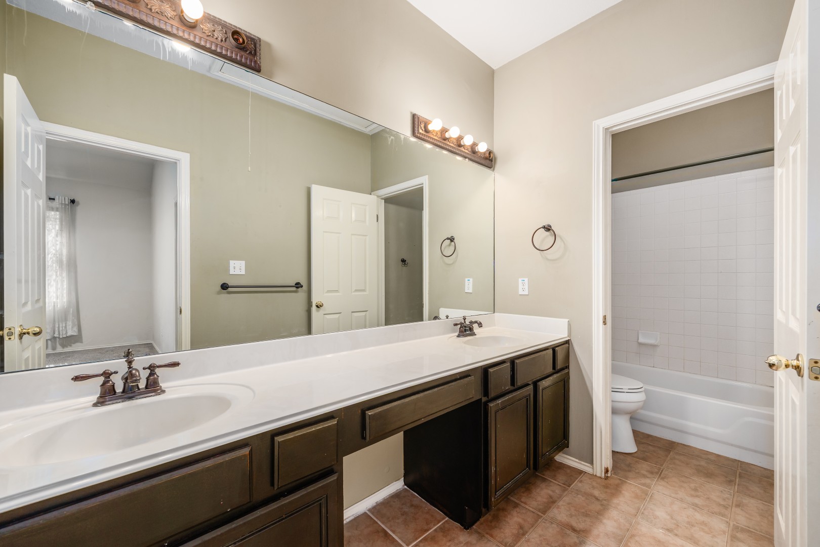 1108 Antelope Ridge Cedar Park, TX 78613 - Photo 5 of 39 A spacious double vanity and tile flooring highlight this classic bathroom layout.