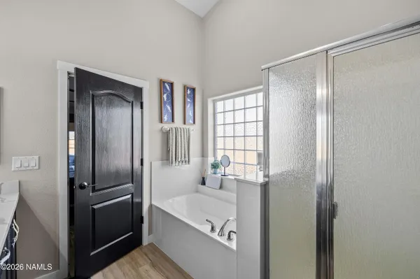 a bathroom with a bathtub and a sink