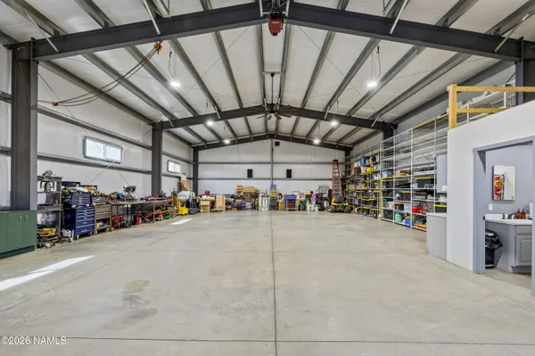 a view of parking garage with cars