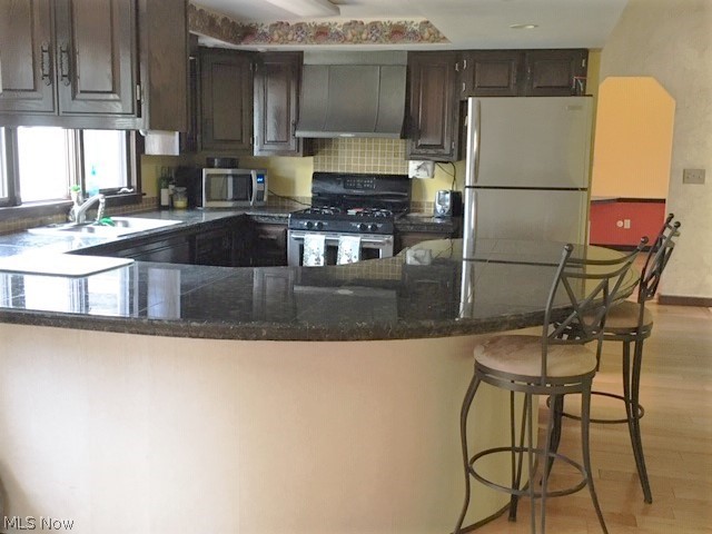 15429 Tavern Road Burton, OH 44021 - Photo 3 of 34 The kitchen features granite counters, stainless appliances, loads of working space and a breakfast bar.