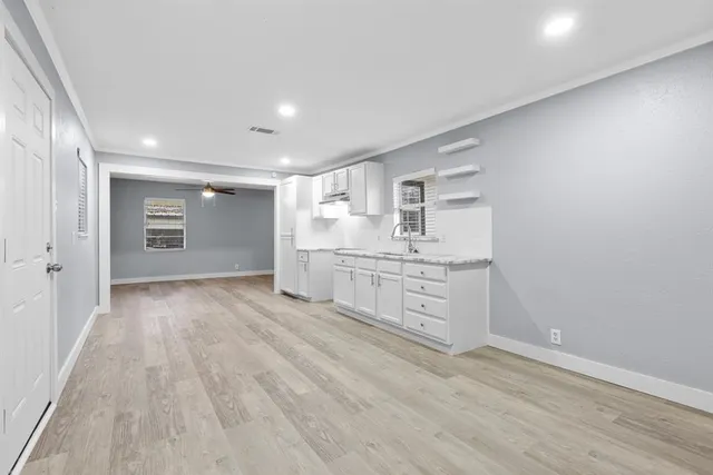 a room with natural light and wooden floors