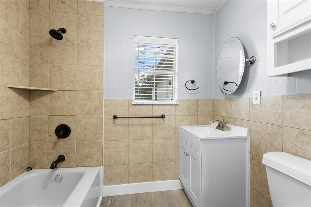 10474 Apache Street Wills Point, TX 75169 - Photo 17 of 29 a bathroom with a sink a toilet and shower