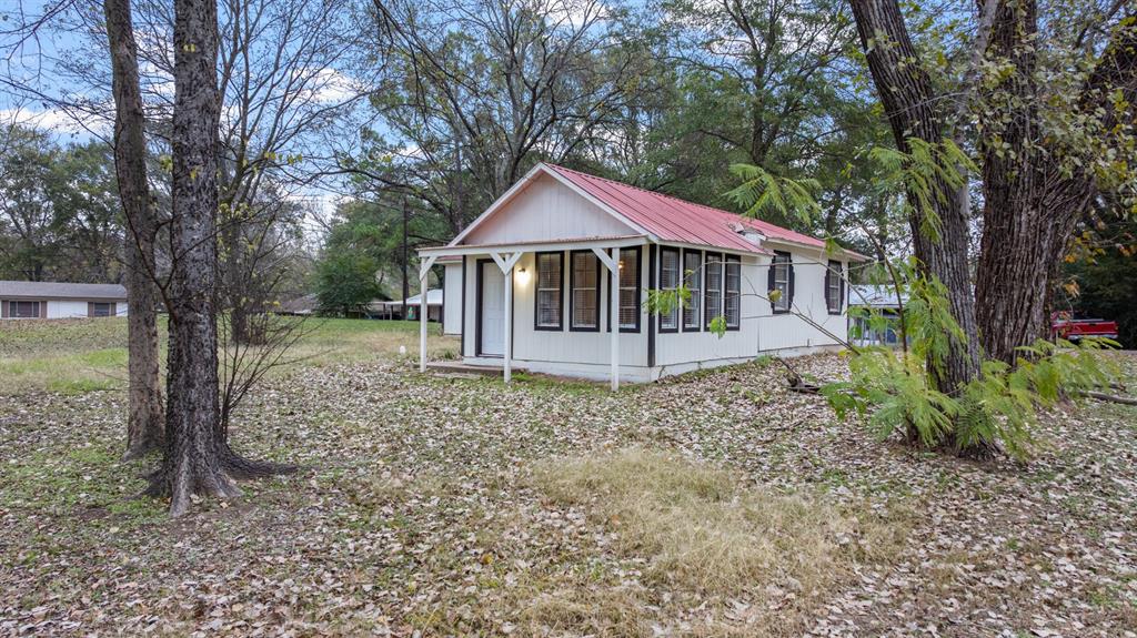 10474 Apache Street Wills Point, TX 75169 - Photo 26 of 29 a house with trees in the background