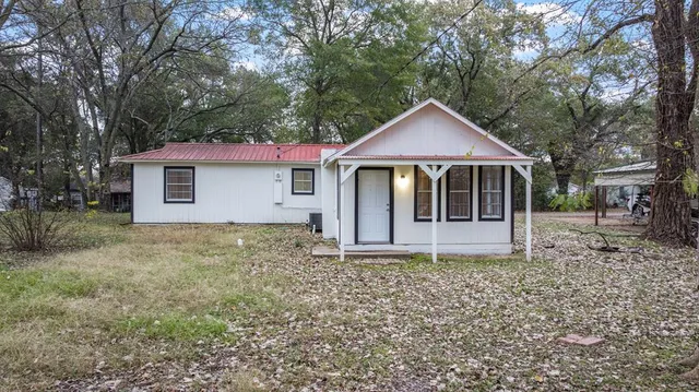 a house with trees in the background