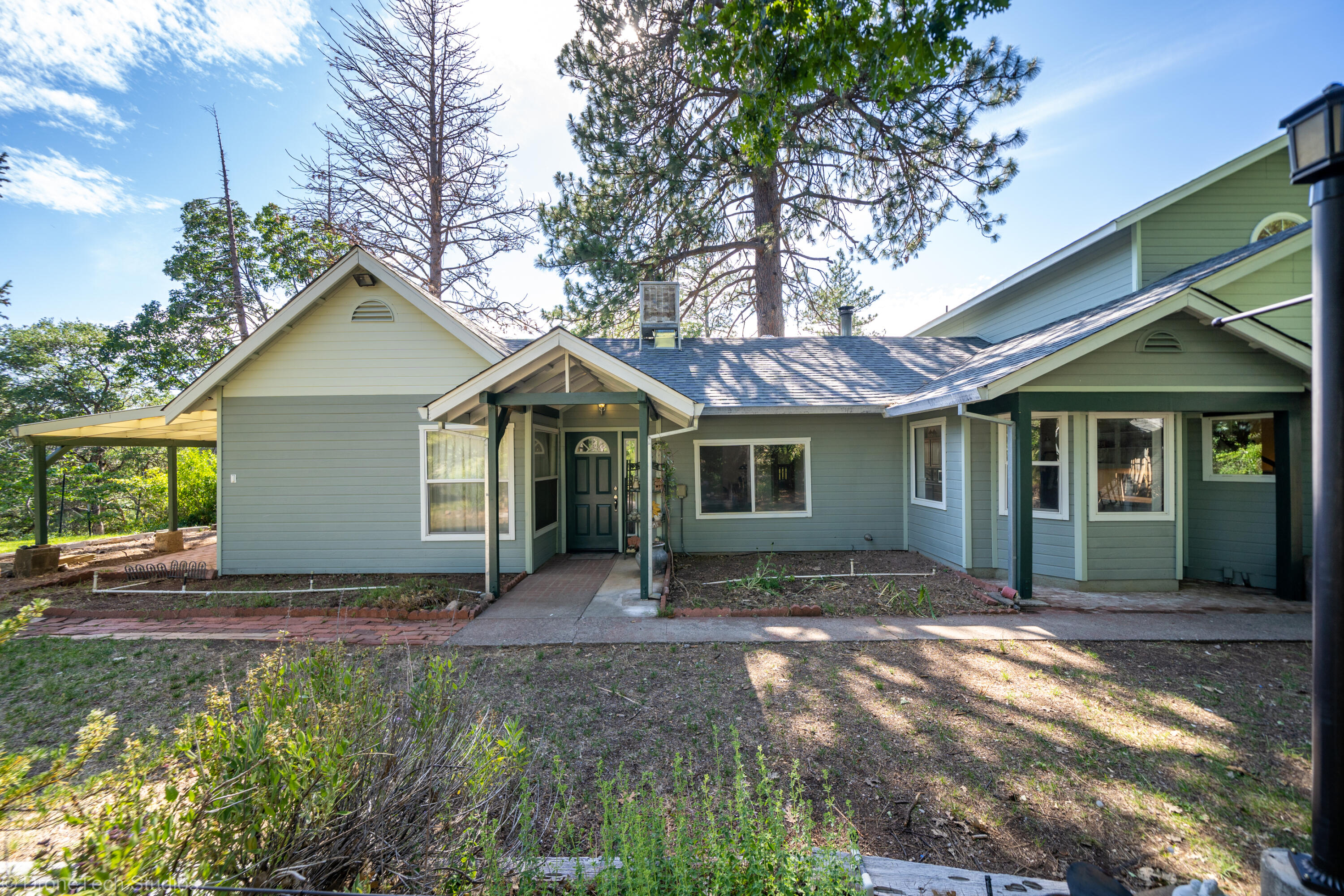 31250 2 Ponds Road Whitmore, CA 96096 - Photo 8 of 60 a front view of a house with yard