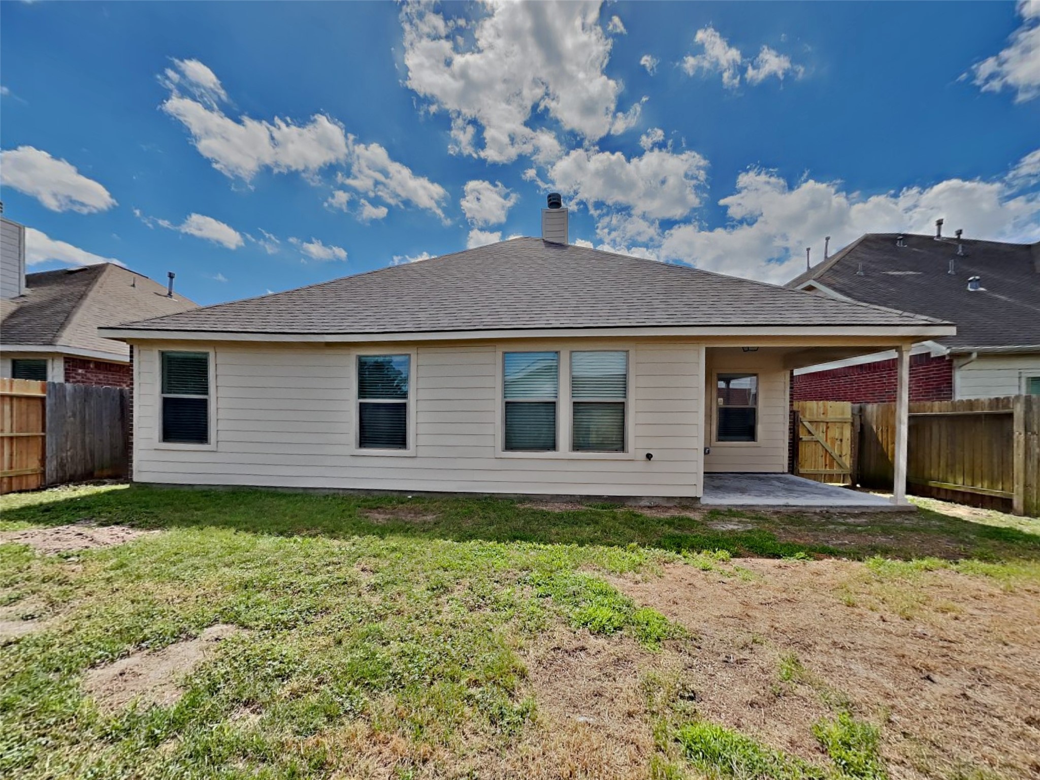 3007 Lockeridge Village Drive Spring, TX 77386 - Photo 17 of 18 a view of a house with a large tree and a yard