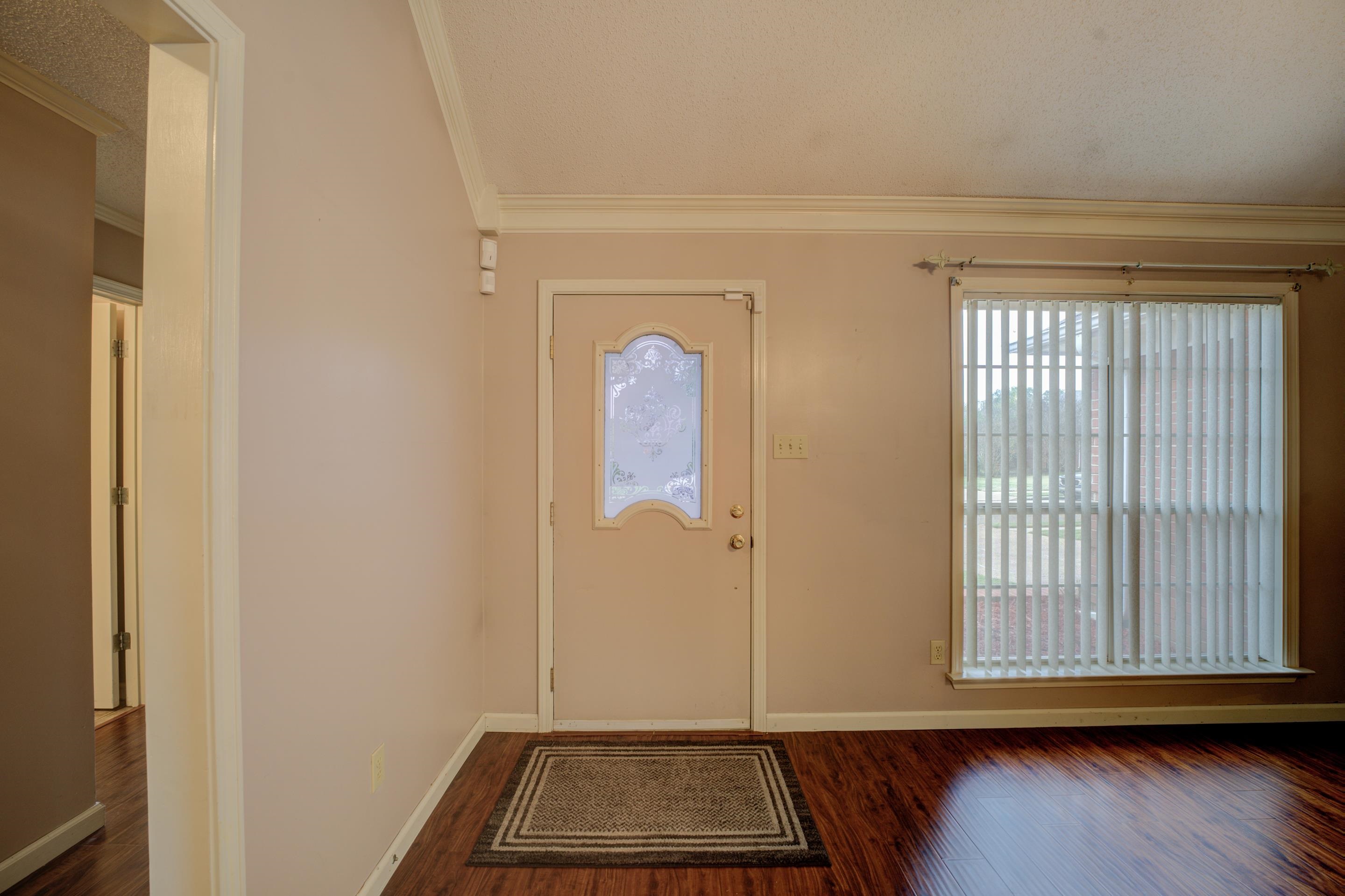 7657 Stone Manor Road Memphis, TN 38125 - Photo 5 of 27 Foyer featuring ornamental molding and dark hardwood / wood-style floors