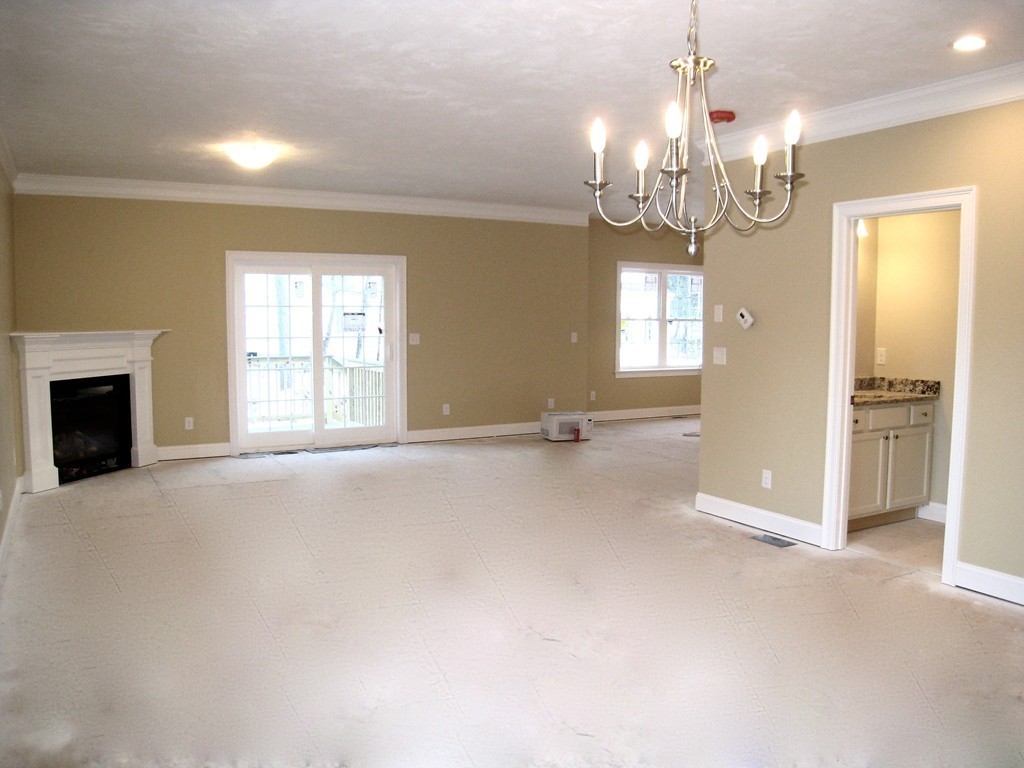 81 Partridge Hill Road Sutton, MA 01590 - Photo 8 of 23 a view of a livingroom with a chandelier fan and windows