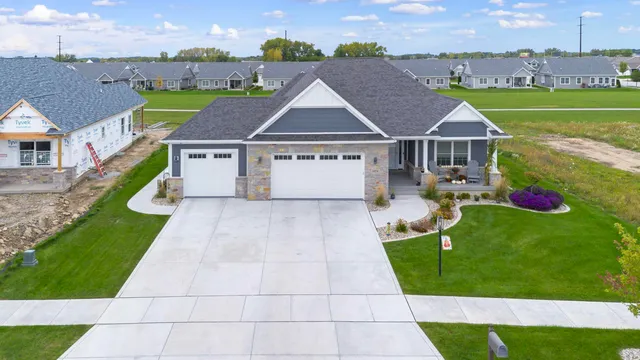 an aerial view of a house with a big yard