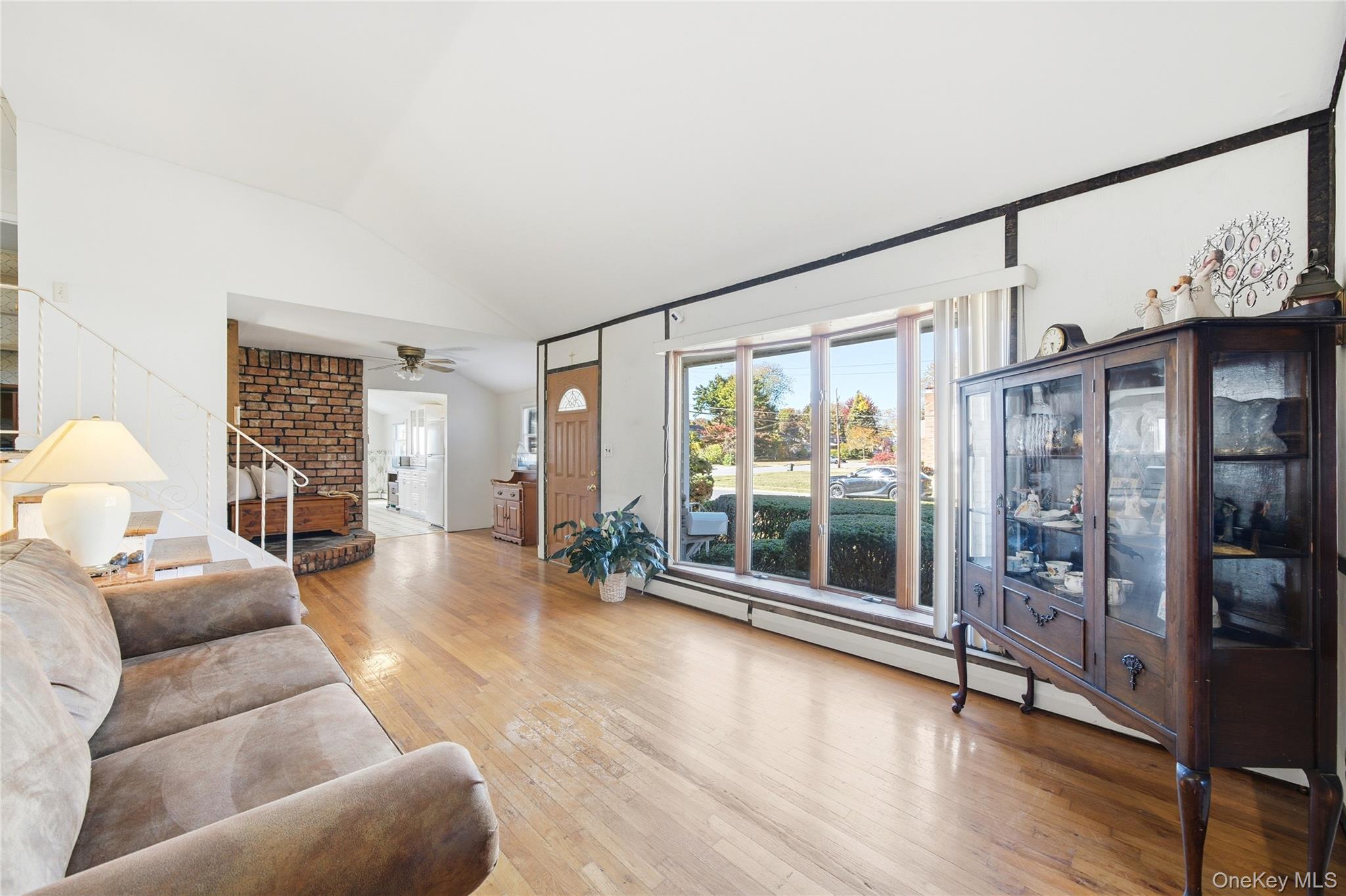 68 7th Street Bay Shore, NY 11706 - Photo 2 of 21 a living room with furniture and a large window
