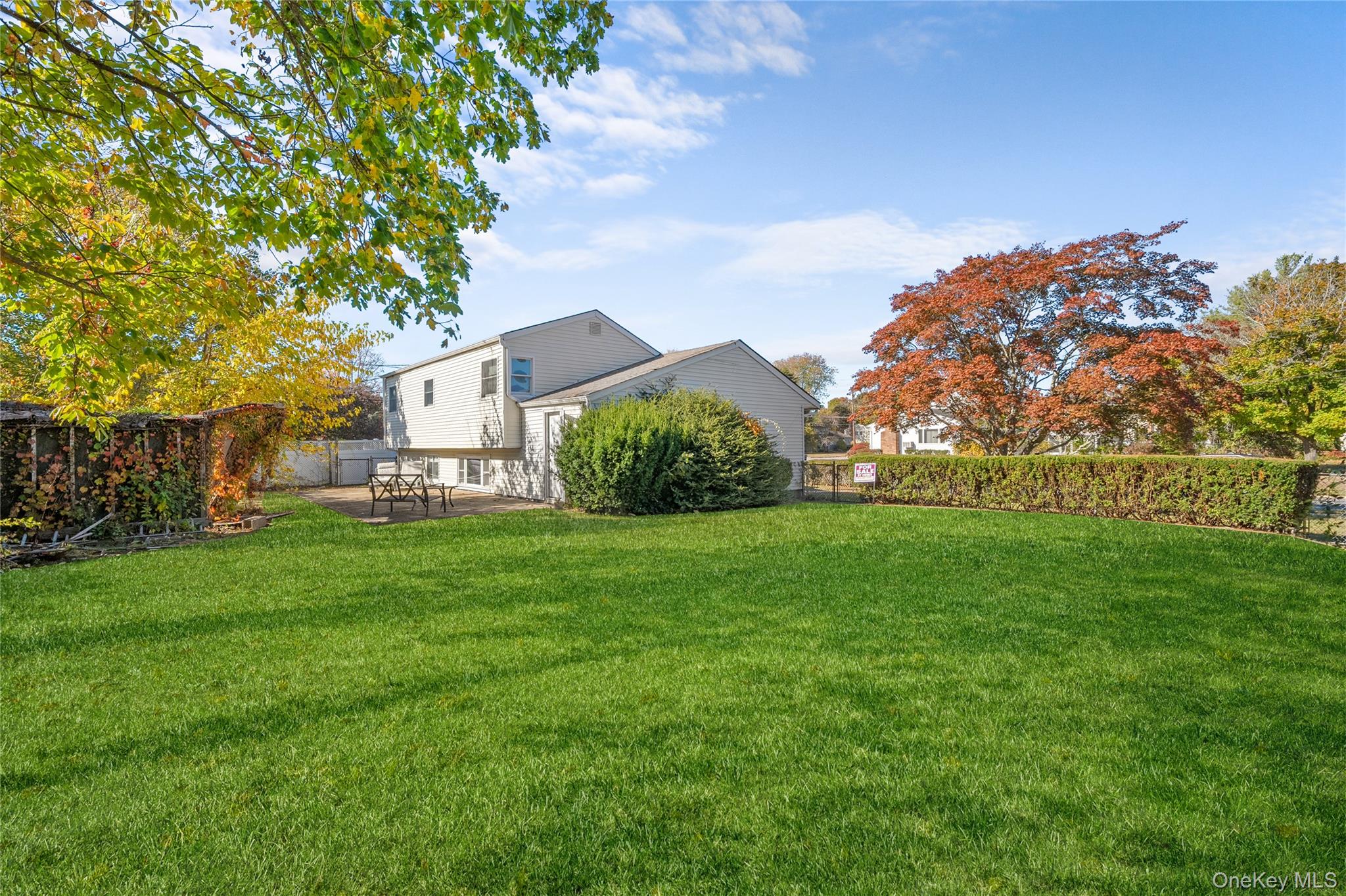 68 7th Street Bay Shore, NY 11706 - Photo 21 of 21 a view of a garden with a building in the background