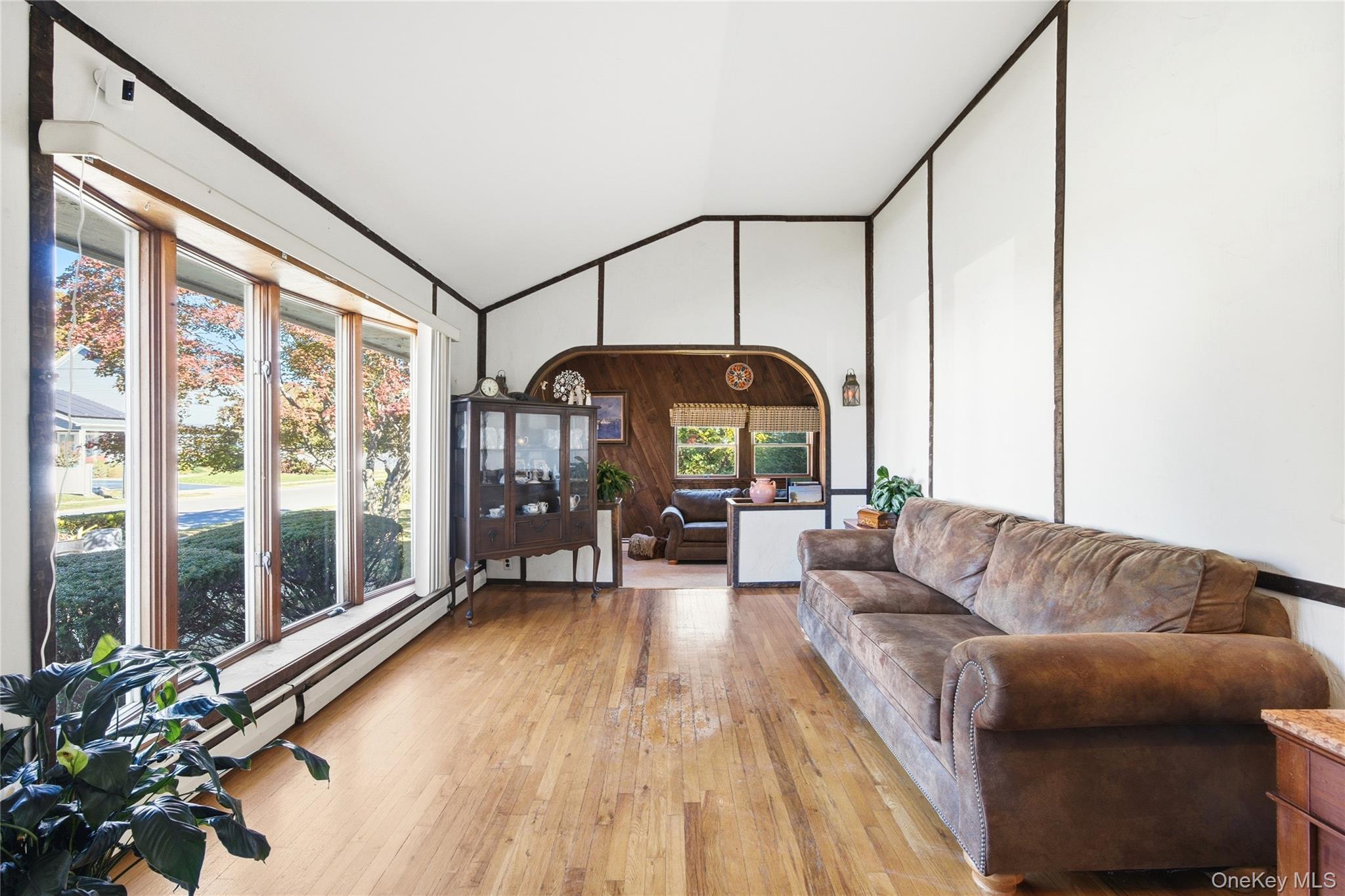68 7th Street Bay Shore, NY 11706 - Photo 3 of 21 a living room with furniture and a large window