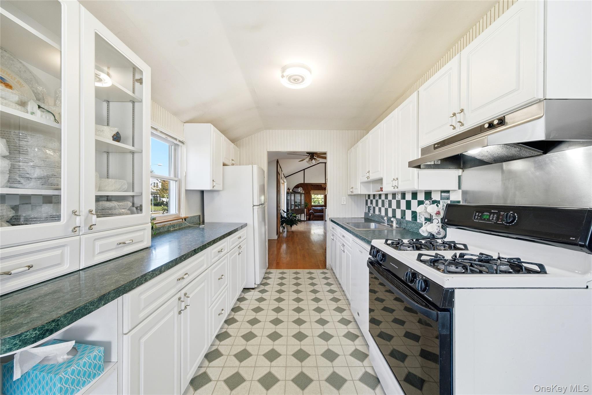 68 7th Street Bay Shore, NY 11706 - Photo 10 of 21 a large kitchen with stainless steel appliances granite countertop a stove and a sink