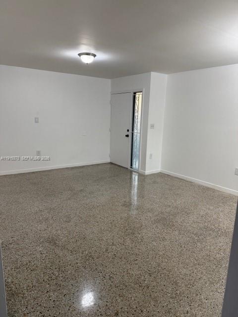 1685 West 41st Street, Unit 5 Hialeah, FL 33012 - Photo 3 of 9 an empty room with a natural light