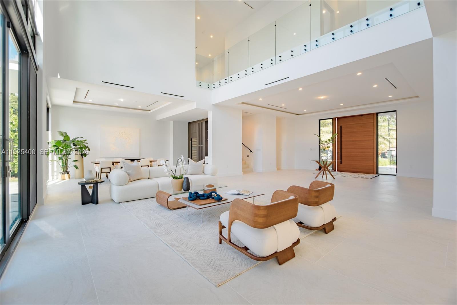 9840 Southwest 73rd Court Pinecrest, FL 33156 - Photo 13 of 67 Formal living room with a massive lobby and grand entry
