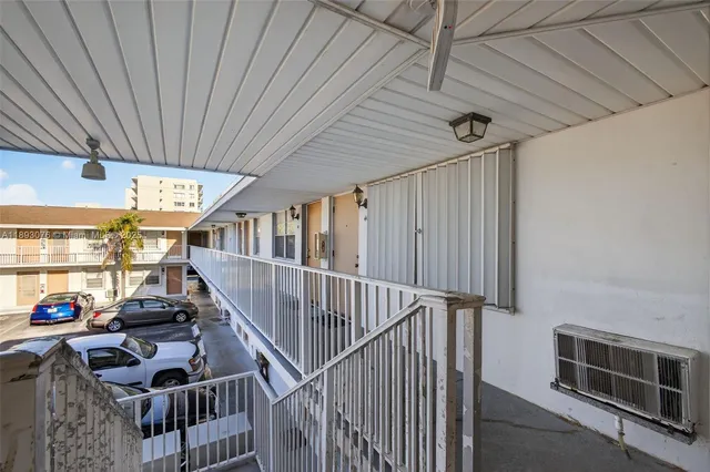 a view of a building with a yard