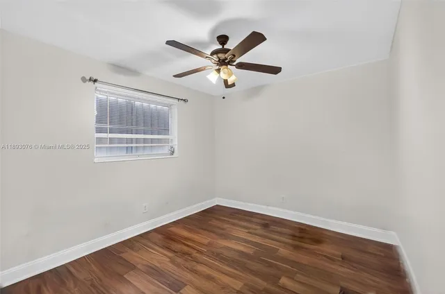 a bathroom with a toilet a sink a mirror and vanity