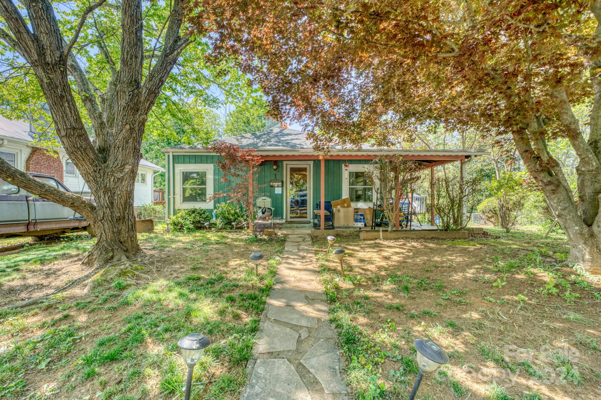 a house view with a garden space