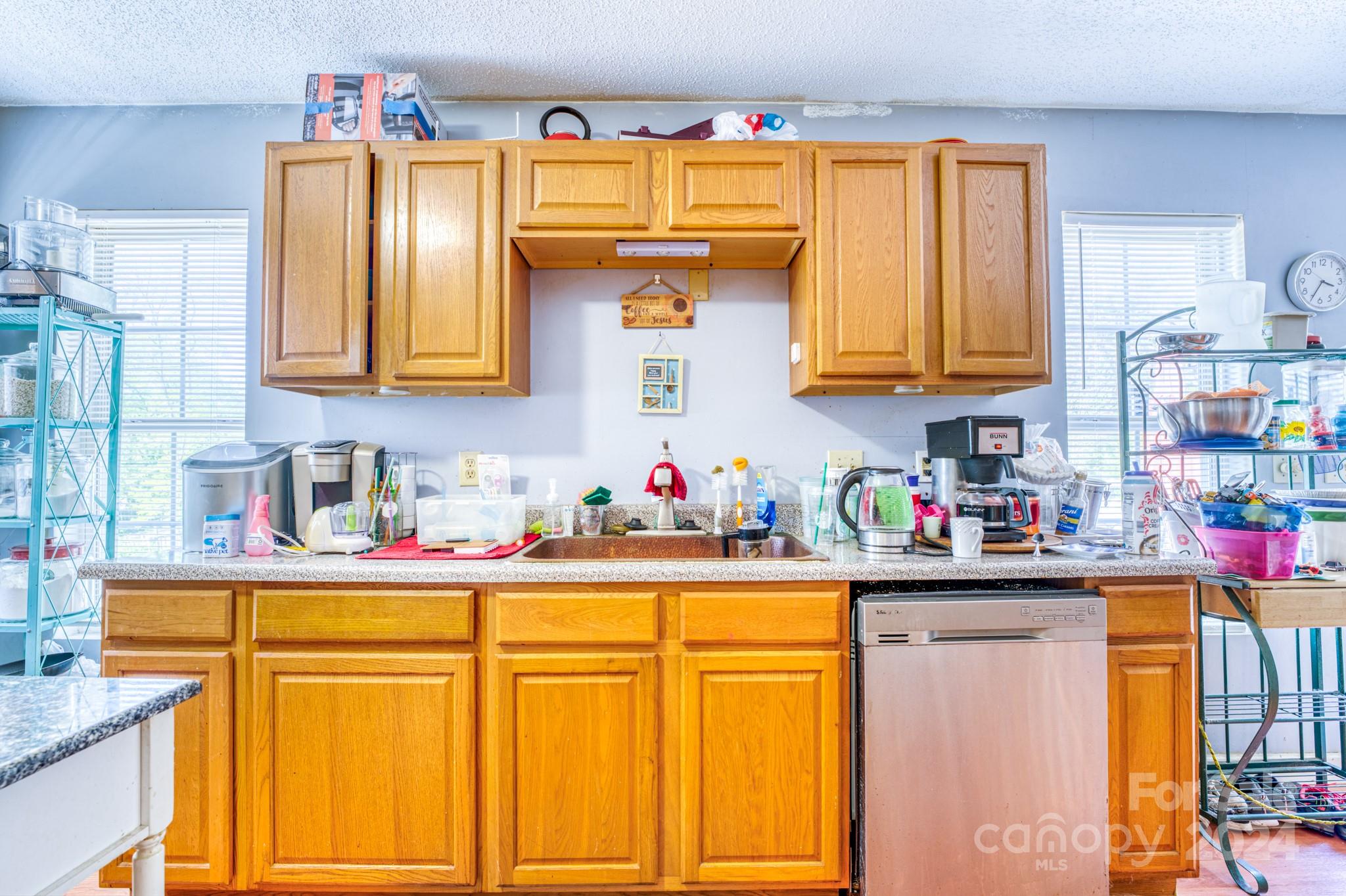 1 Westgate Road Asheville, NC 28806 - Photo 13 of 25 a kitchen with stainless steel appliances a sink and cabinets