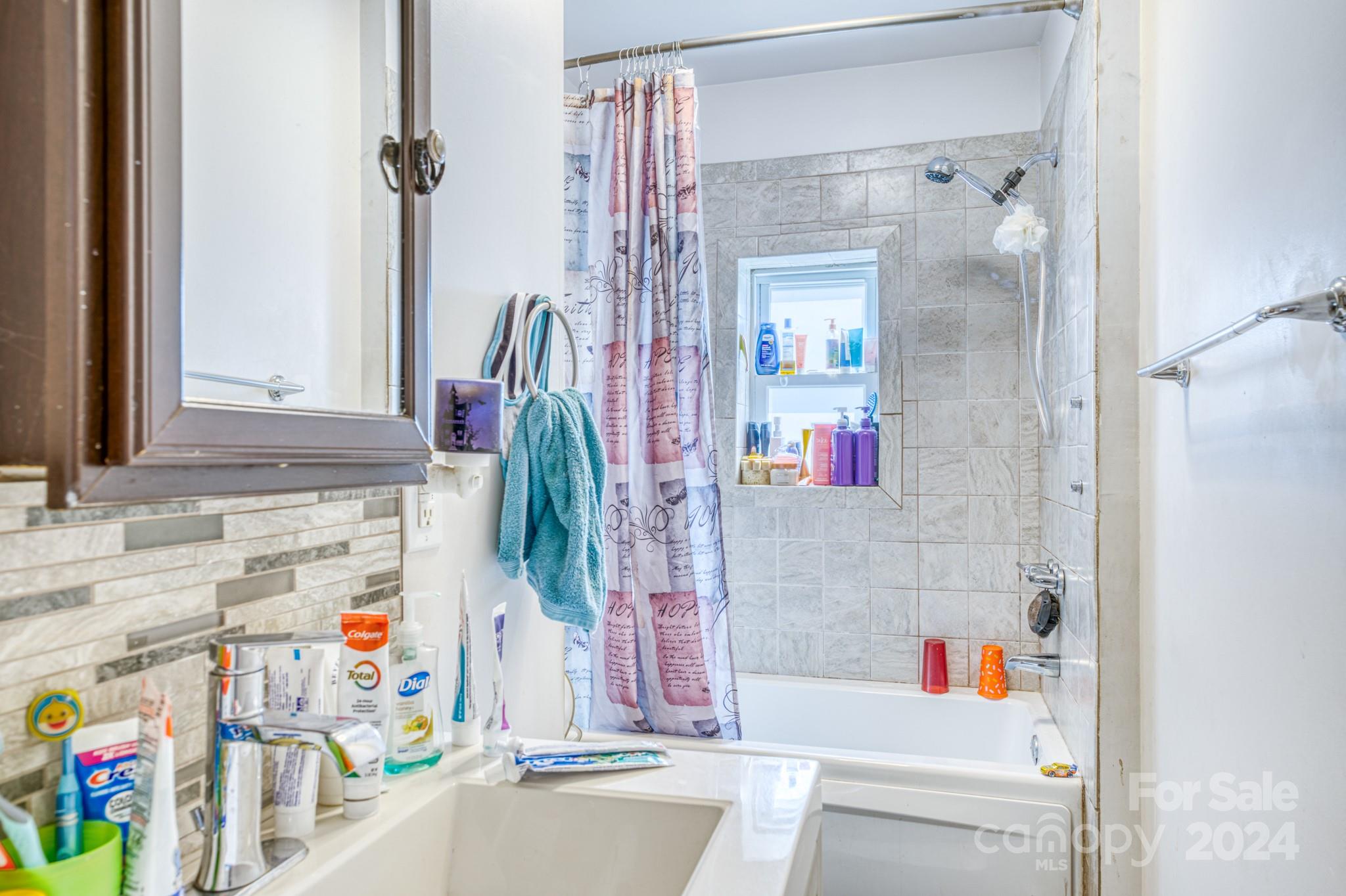 1 Westgate Road Asheville, NC 28806 - Photo 16 of 25 a bathroom with a bathtub and a shower