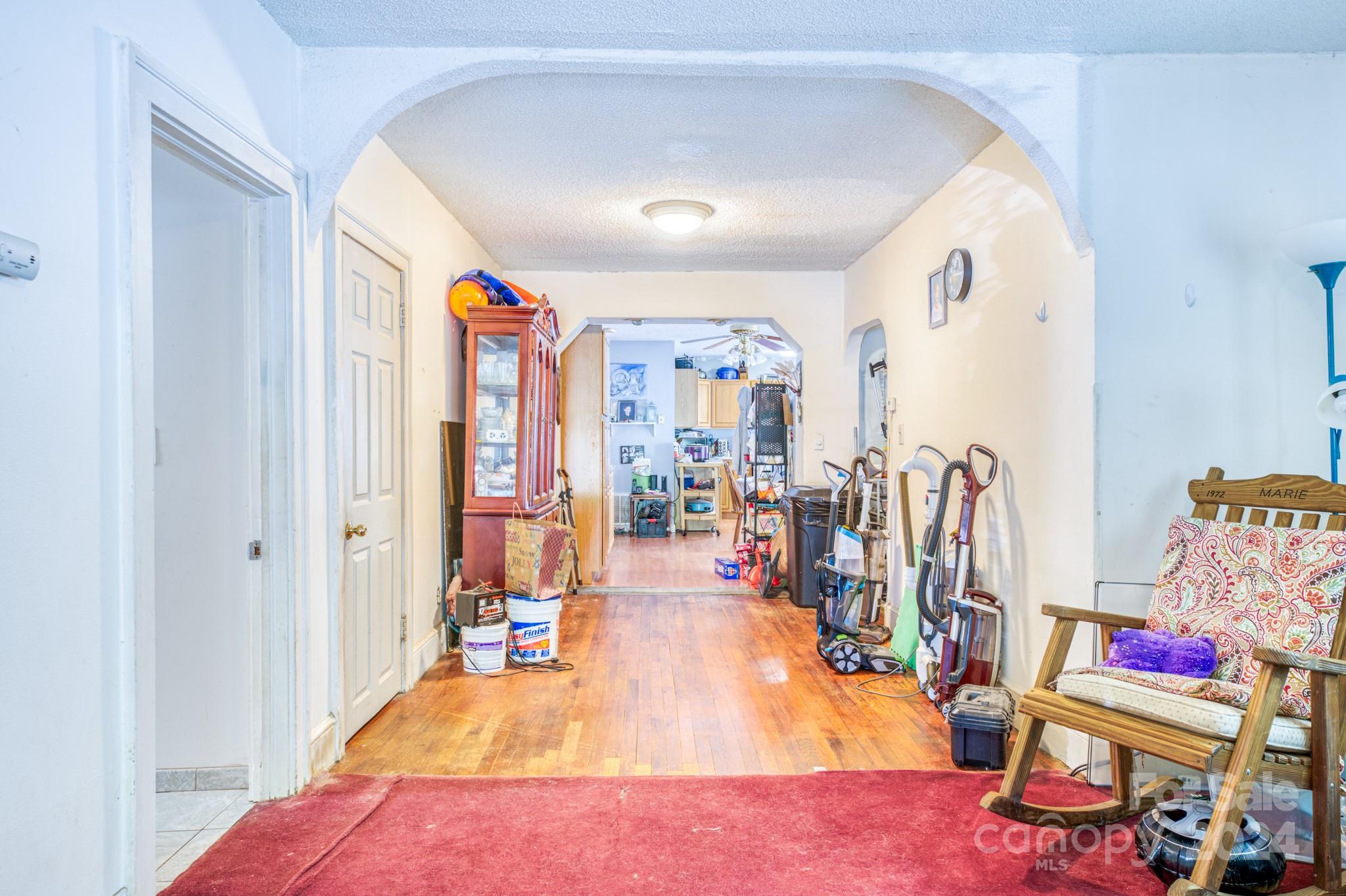 1 Westgate Road Asheville, NC 28806 - Photo 19 of 25 a living room with lots of furniture and a view of bedroom
