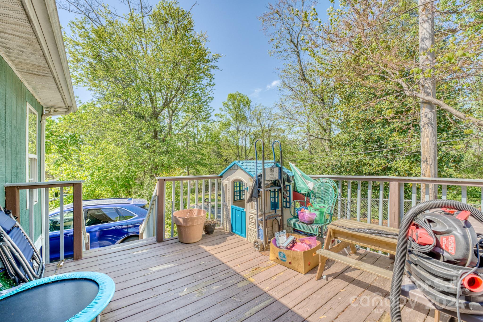 1 Westgate Road Asheville, NC 28806 - Photo 23 of 25 a view of a deck with wooden floor and seating space