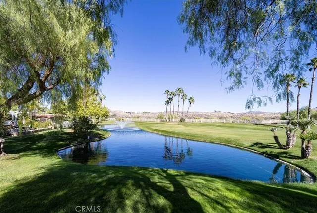 a view of a lake and a yard