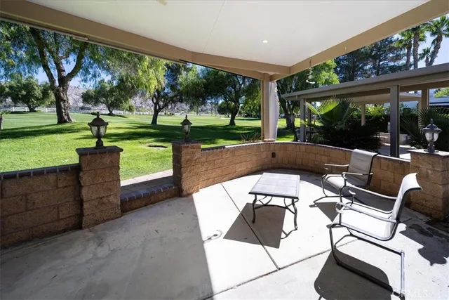 a view of a patio with swimming pool
