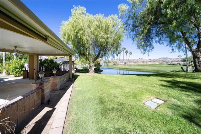 an aerial view of a house with a yard and garden