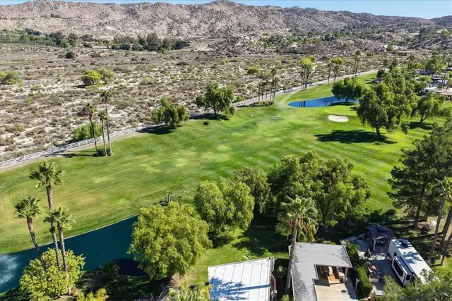 a view of a yard and mountain