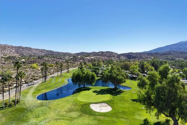a view of a swimming pool with a yard