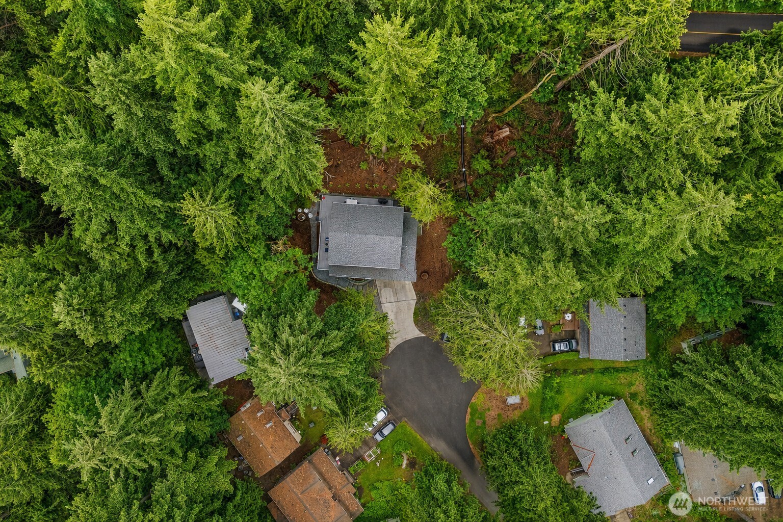 23 Spring Court Bellingham, WA 98229 - Photo 36 of 38 an aerial view of a house with a yard and trees