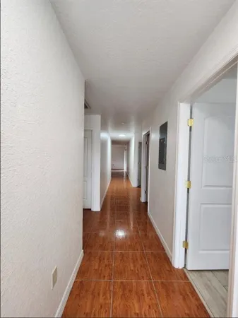 a view of gallery with wooden floor
