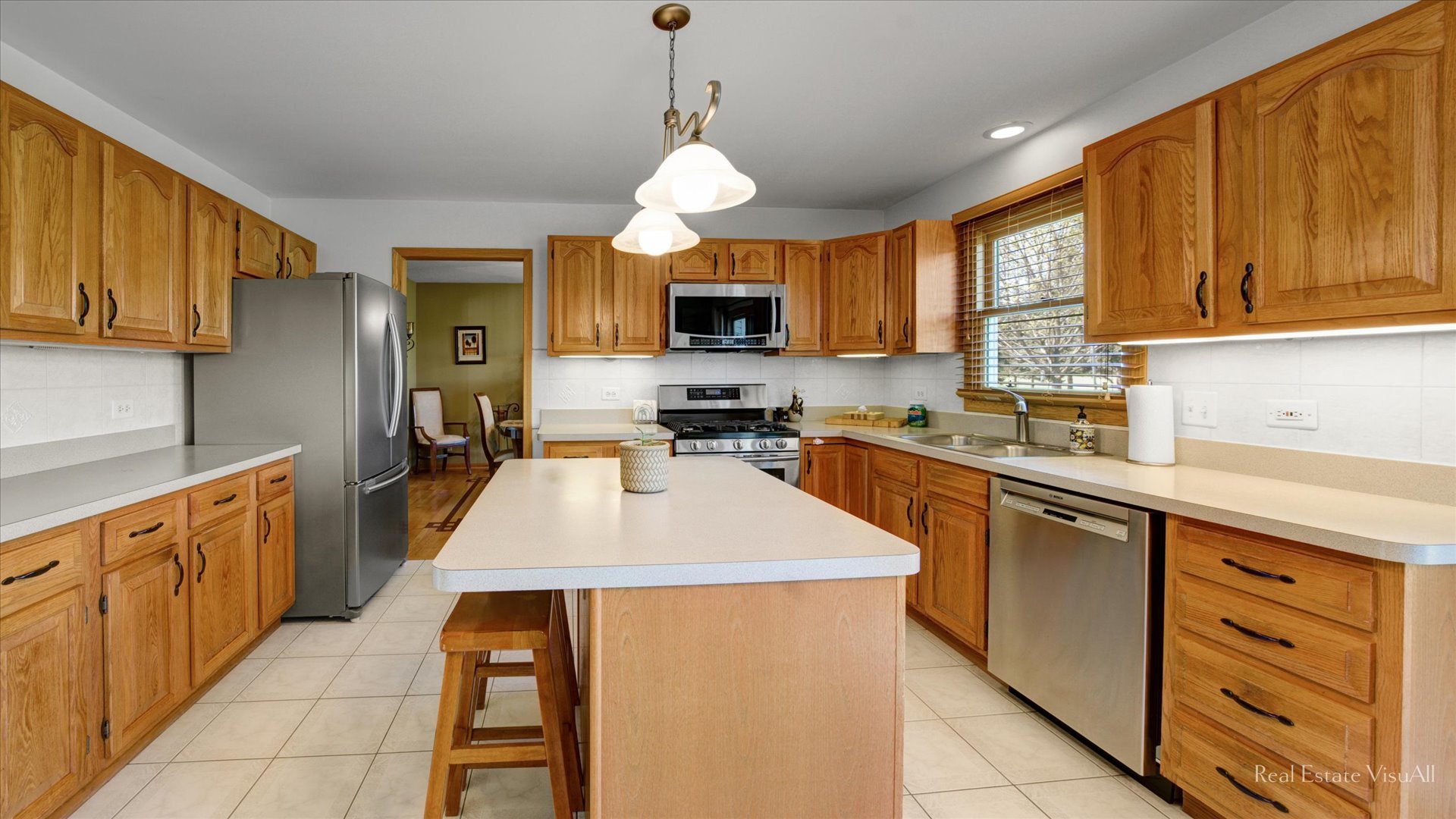 1808 Edgewood Drive Algonquin, IL 60102 - Photo 11 of 39 a kitchen with stainless steel appliances kitchen island granite countertop a stove top oven a sink dishwasher and a microwave oven on the blue kitchen countertops
