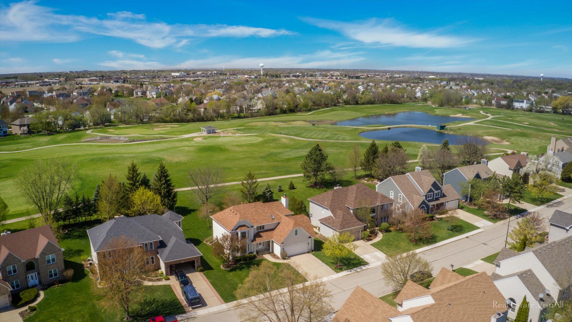 1808 Edgewood Drive Algonquin, IL 60102 - Photo 2 of 39 a view of a city from a lake