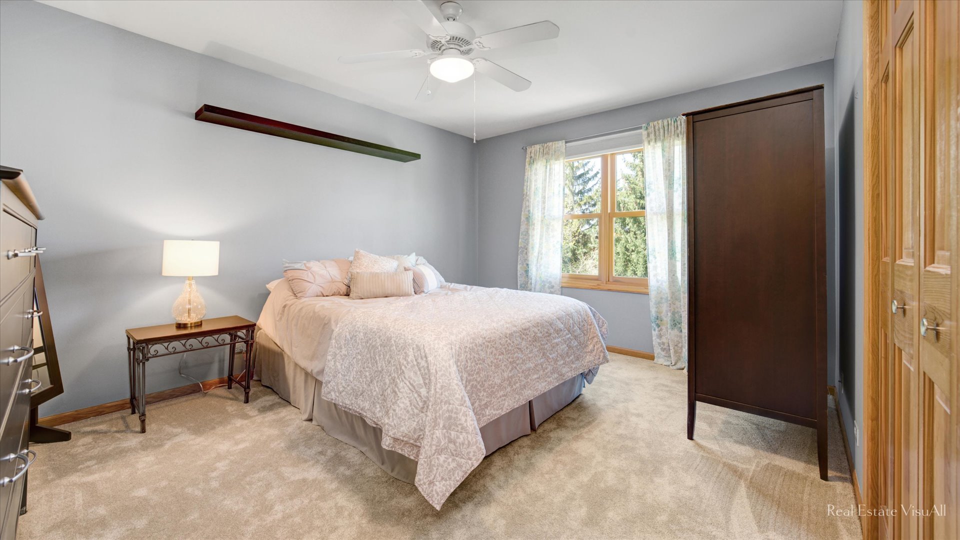 1808 Edgewood Drive Algonquin, IL 60102 - Photo 24 of 39 a spacious bedroom with a bed and a chandelier