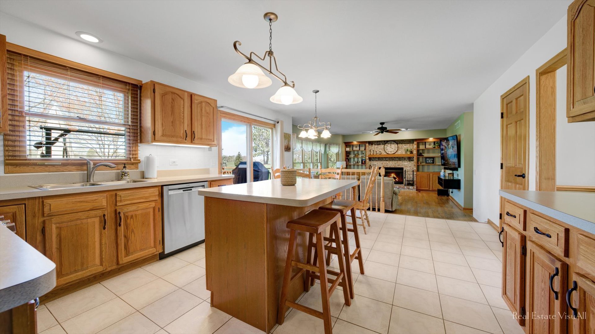 1808 Edgewood Drive Algonquin, IL 60102 - Photo 10 of 39 a kitchen with stainless steel appliances kitchen island granite countertop a sink and cabinets