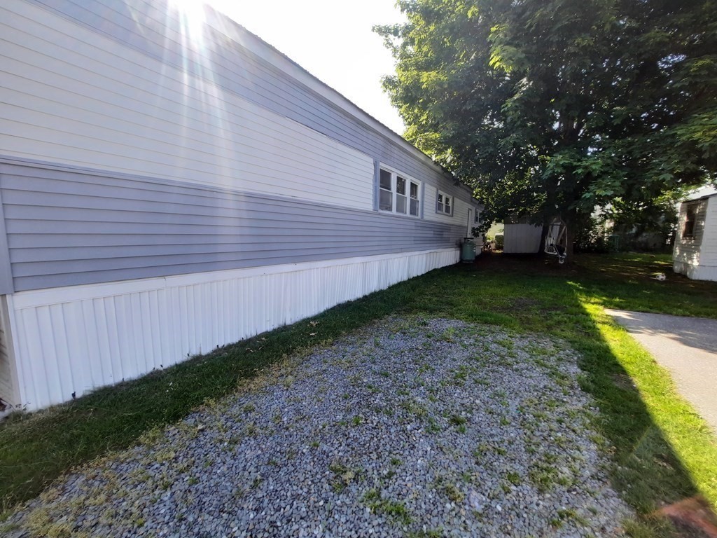 270 Littleton Road, Unit 182 Chelmsford, MA 01824 - Photo 3 of 22 a view of a backyard with large trees
