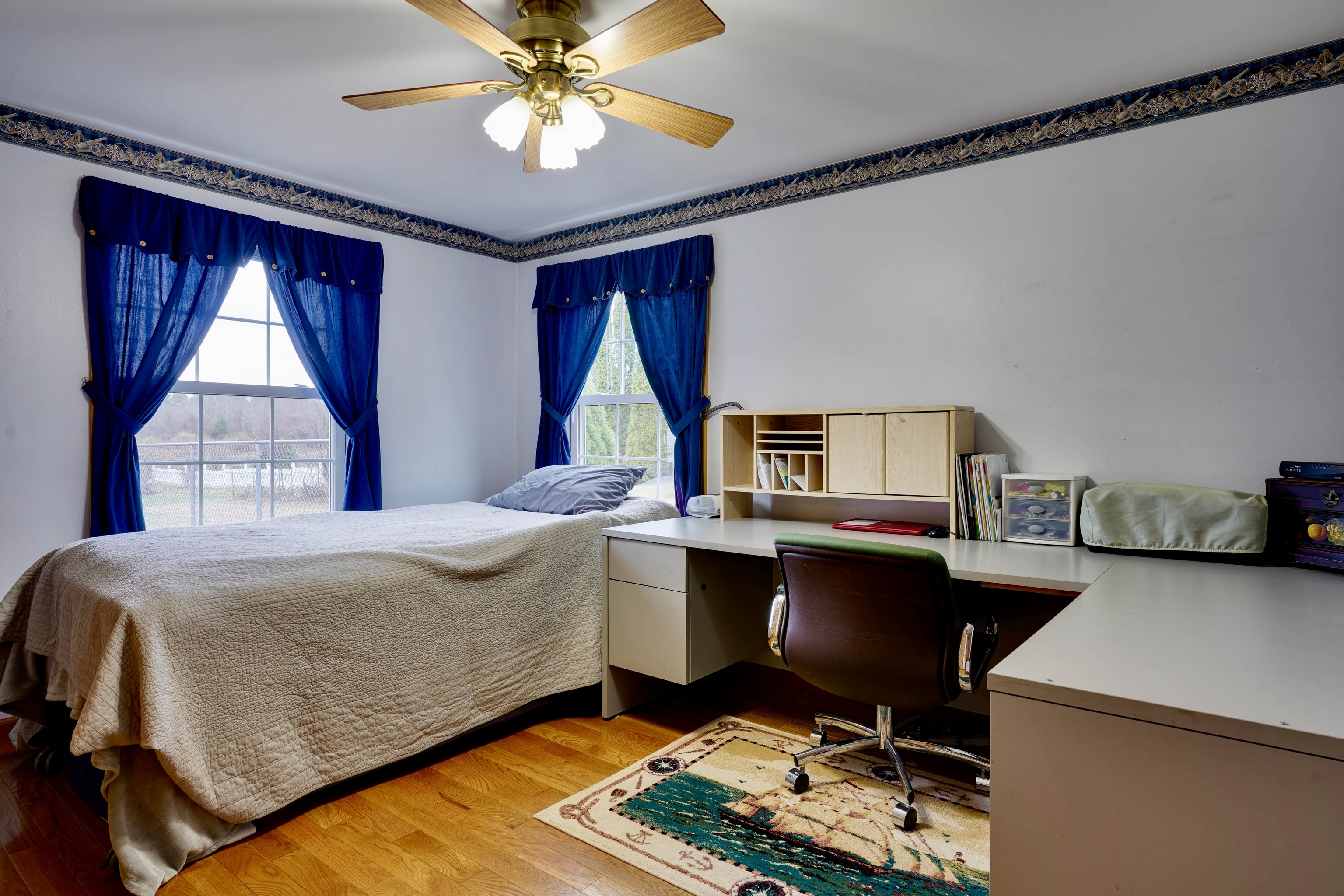 85 Bailey Woods Road Brooklyn, CT 06234 - Photo 12 of 35 a bedroom with a bed and a chandelier