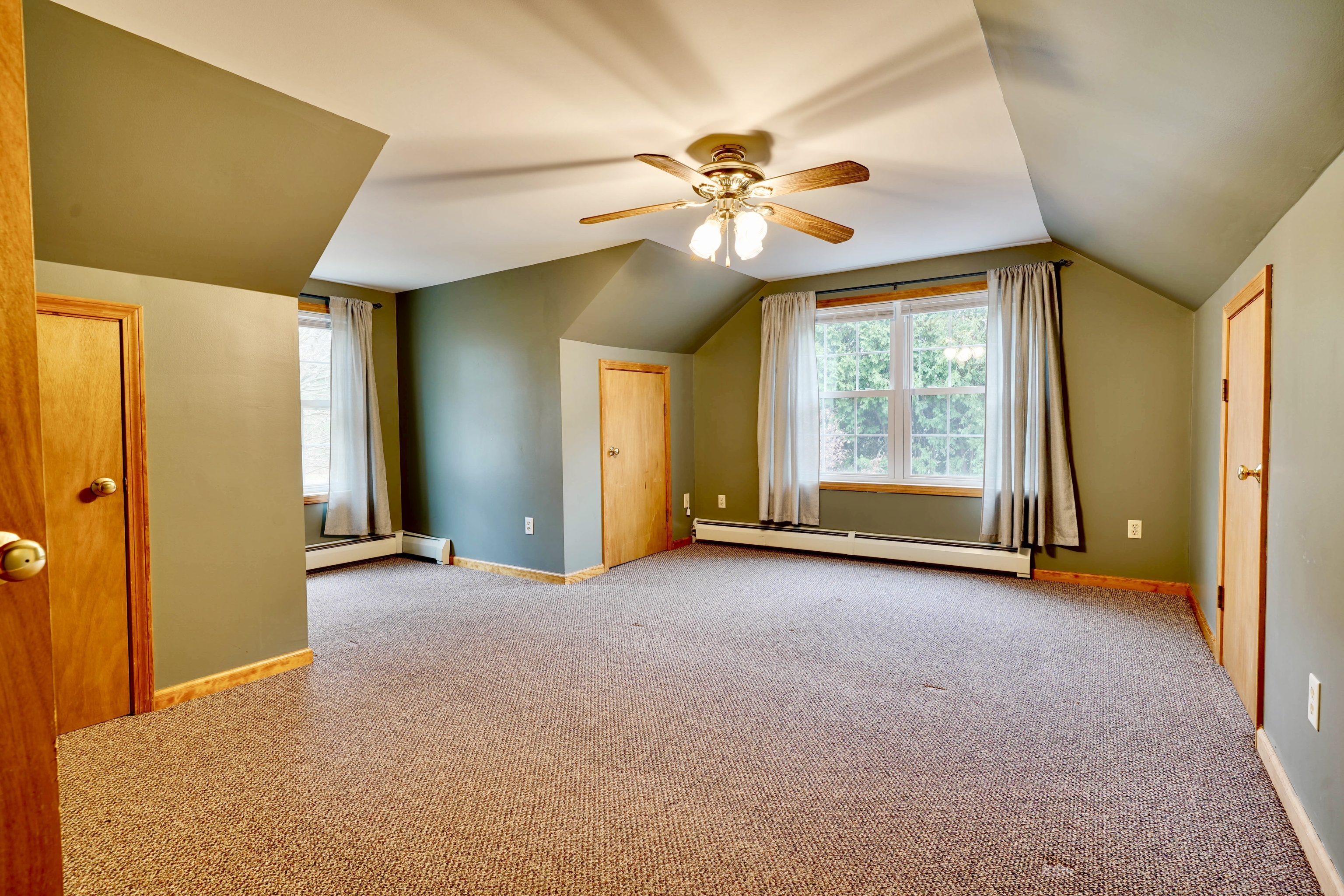 85 Bailey Woods Road Brooklyn, CT 06234 - Photo 16 of 35 an empty room with windows and fan