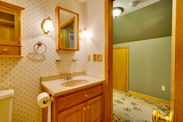 a bathroom with a sink and a mirror