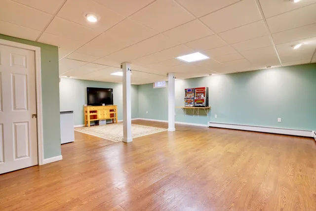 a bedroom with a bed and a night stand